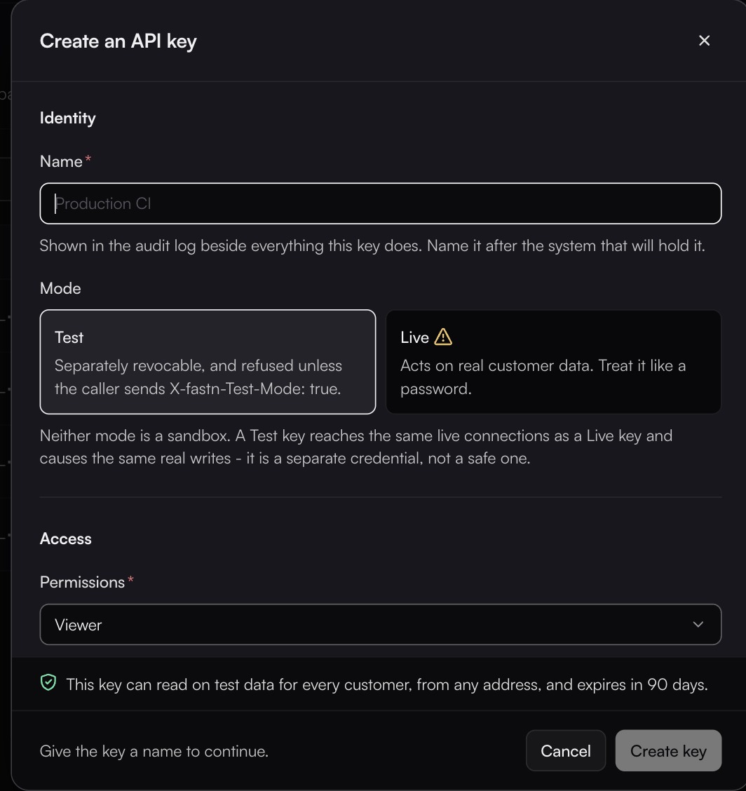 The Create an API key dialog with a Name field, Mode cards Test selected and Live carrying a warning, Permissions set to Viewer, and a line saying the key reads test data and expires in 90 days